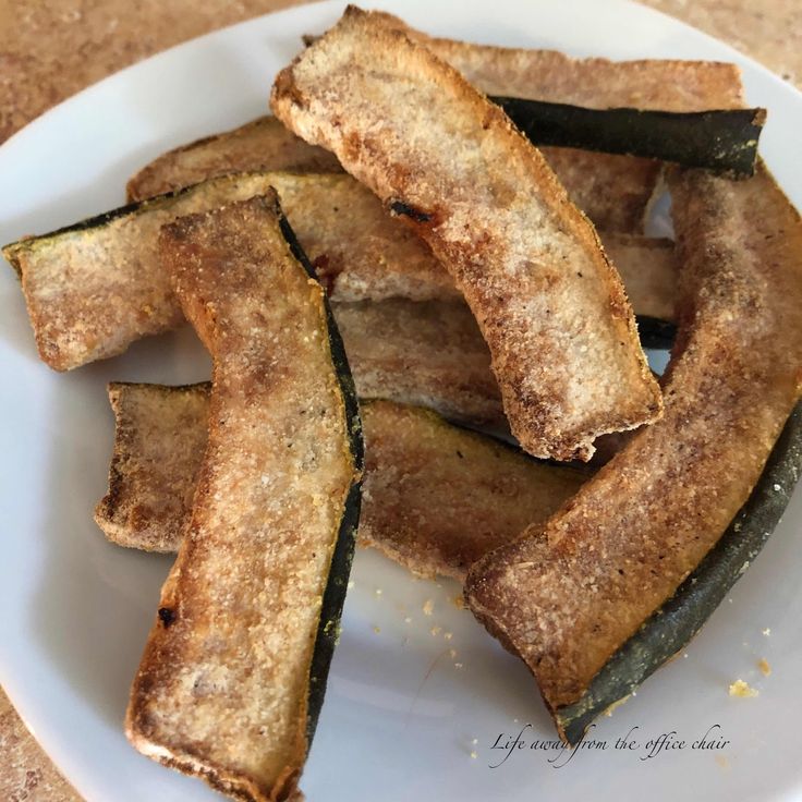 some fried zucchini on a white plate