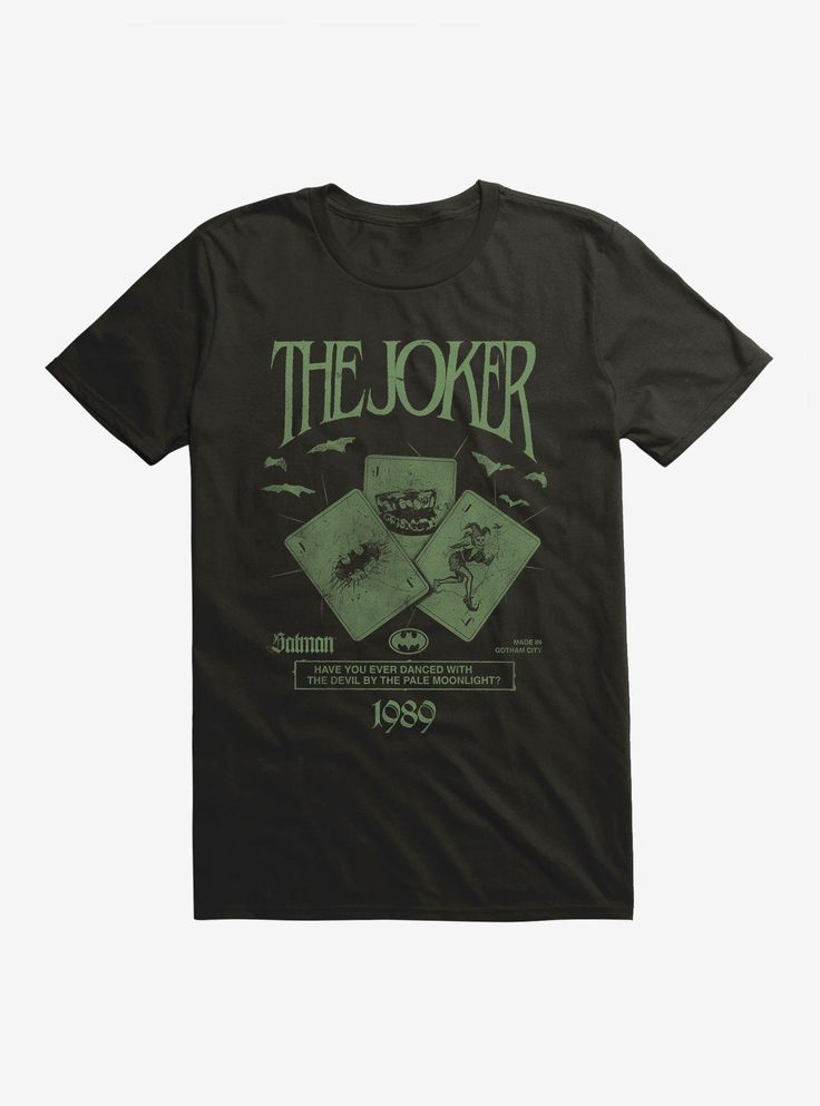 a black t - shirt with an image of the joker playing cards in front of it