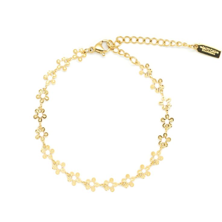 Crafted with high quality materials, this adorable bracelet features a string of delicate golden flowers, each one delicately crafted with intricate details. The soft gold tones of the flowers add a touch of warmth to any ensemble and its lightweight construction makes it comfortable to wear all day. Product Details Water friendly, stainless steel and gold plated Length: 6" + 2" extension Spring Gold Jewelry With Flower Charm, Delicate Adjustable Yellow Gold Charm Bracelet, Elegant Spring Bracelets In Flower Shape, Dainty Gold Jewelry For Spring, Elegant Flower-shaped Bracelets For Spring, Dainty Yellow Gold Bracelet With Flower Charm, Elegant Spring Flower-shaped Bracelets, Delicate Adjustable Gold Charm Bracelet, Dainty Adjustable Flower Chain Bracelet