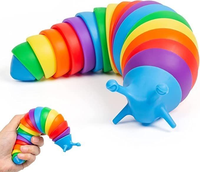 a hand is holding a toy that looks like a caterpillar and rainbow colors