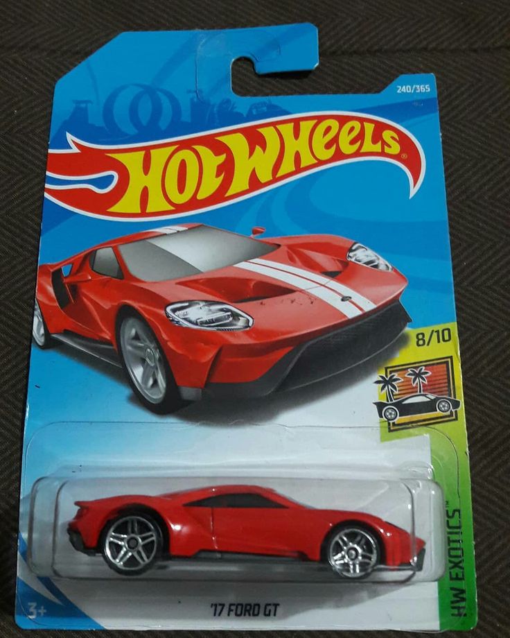 a red hot wheels sports car with white stripes