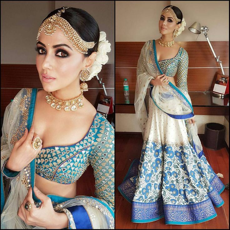 a woman in a blue and white sari