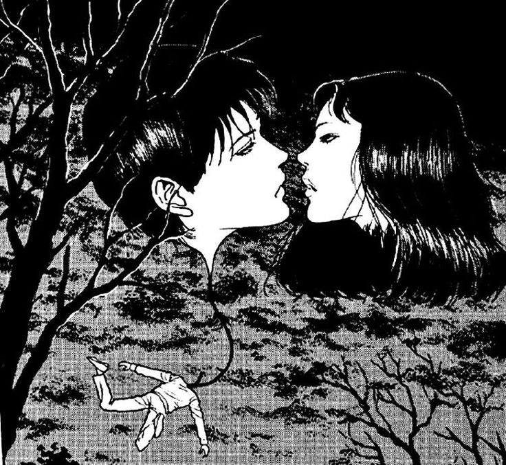 two people kissing in front of trees