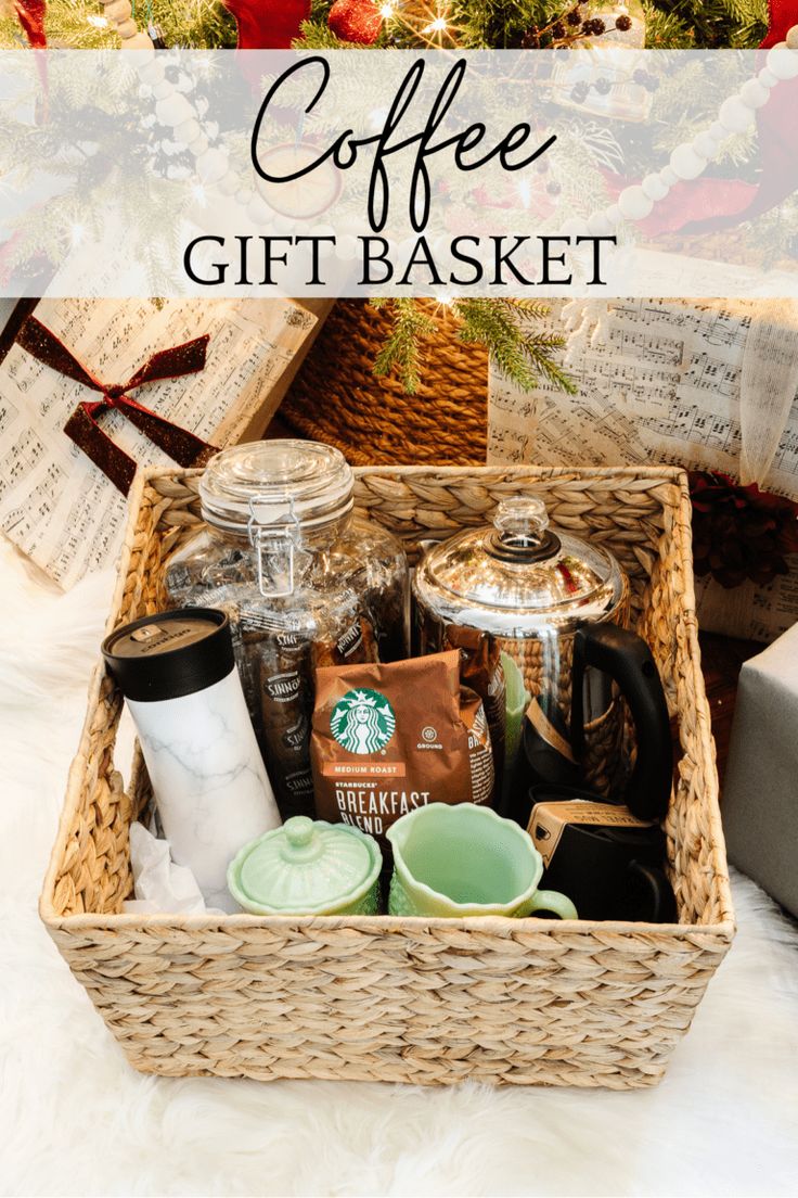 a basket filled with coffee and other items next to a christmas tree