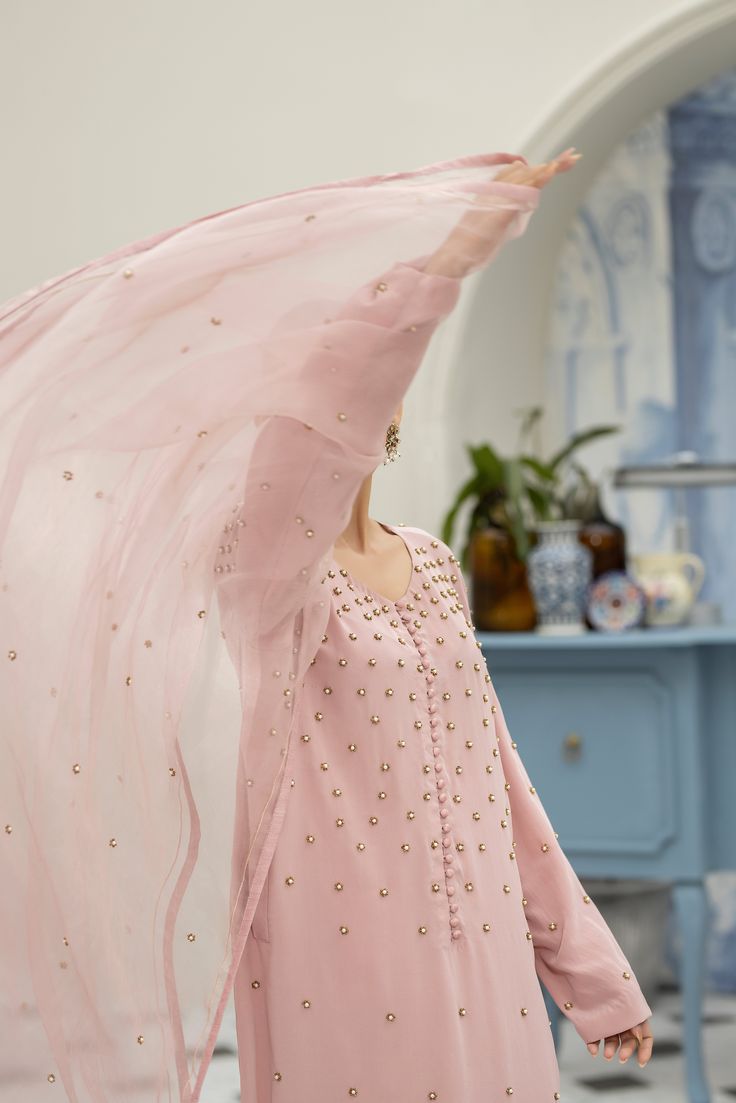 Meet our eye-catching Pale Pink pure crepe silk long shirt all hand worked with a spray of florets made with pearls, beads and sequins, a unique piece that stands out. It's versatile, comfy, and crafted with care. Perfect for making a bold yet elegant statement on any occasion. You can pair with matching pure organza dupatta handworked on the corners with resham motifs with spray of florets (Sold Separately). Astoria Ny, Misty Rose, Organza Dupatta, Saree Dress, Silk Pants, Long Shirt, Wedding Suits, Pale Pink, Silk Saree