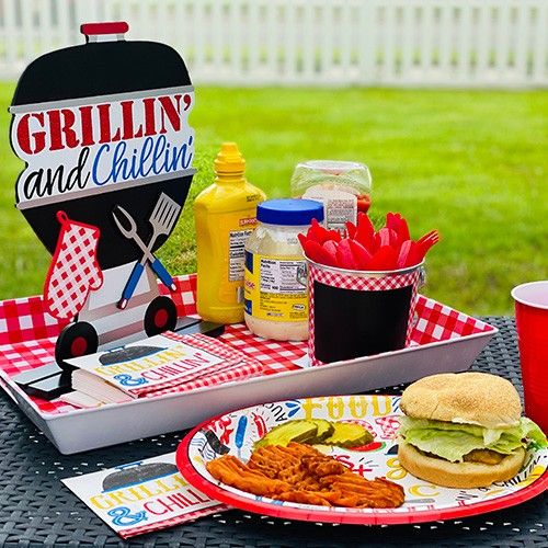 a grillin'and chilli picnic table set up outside