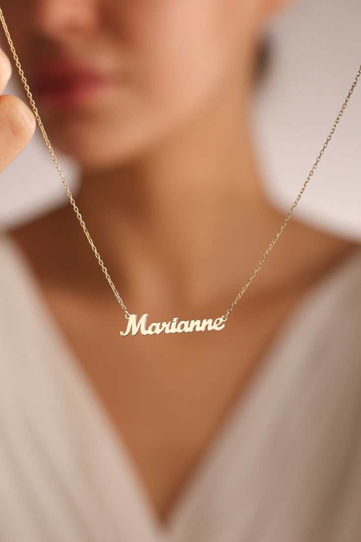 "14k solid gold name necklaces are great personalized gift ideas for special people. You can personalize this gold name necklace and silver name necklace with your own meaningful message. This stunning piece of custom name necklace allows you to customize with different colors. Everyone loves personalized Jewelry and this name jewelry will be your favorite necklace.   💖 Personalized Name Necklaces are one of the most loved designs by our customers. 🎁Great Dainty necklace as mother necklace, Christmas Gift, birthday gift, mothers day gifts, Gifts for mom ✋All our jewelry is %100 custom made by hand with Love and Care in our workshop! Nickel Free High Quality Materials Standard Deliver in 8-12 Business Days Name size - lowercase letters are approximately 4 mm and uppercase letters are appr Gold Necklaces With Name, Solid Necklace, Silver Name Necklace, Personalized Gift Ideas, Favorite Necklace, Mother Necklace, Name Necklace Gold, Gold Gift Boxes, Name Necklaces