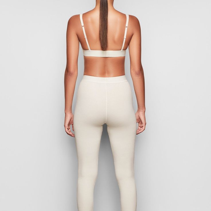 These cotton leggings hug the body yet allow your skin to breathe with cool and comfy natural fibers. The classic, rustic design elevates your lounge look. | SKIMS Legging | White | Cotton Rib Casual Soft Touch Leggings For Loungewear, Casual Leggings With Soft Touch For Loungewear, Seamless Casual Loungewear Leggings, Compressive Seamless Elastane Leggings, Sporty Soft Touch Leggings For Loungewear, Compressive Elastane Leggings With Seamless Construction, Casual Compressive Leggings For Loungewear, Compressive Seamless Leggings Made Of Elastane, Sporty Seamless Fitted Leggings