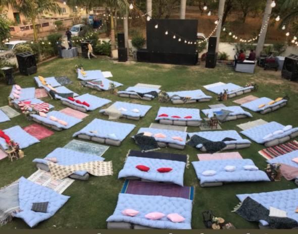 there are many mattresses laid out on the grass