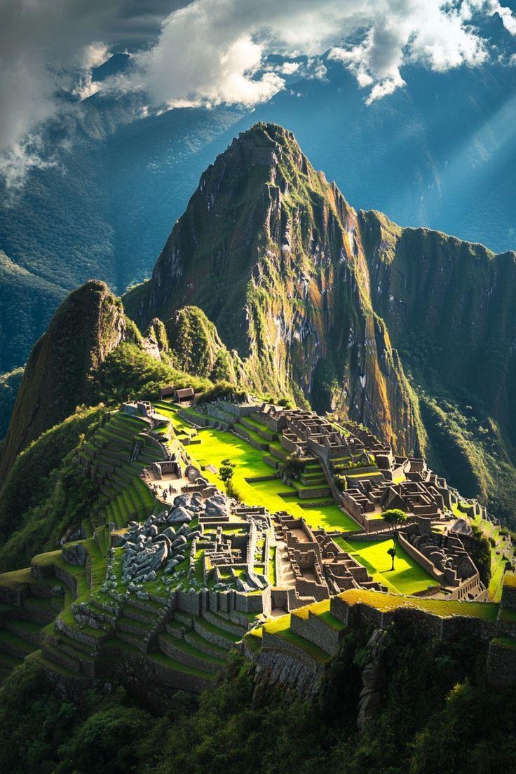 the sun shines down on an ancient city perched on top of a mountain in peru