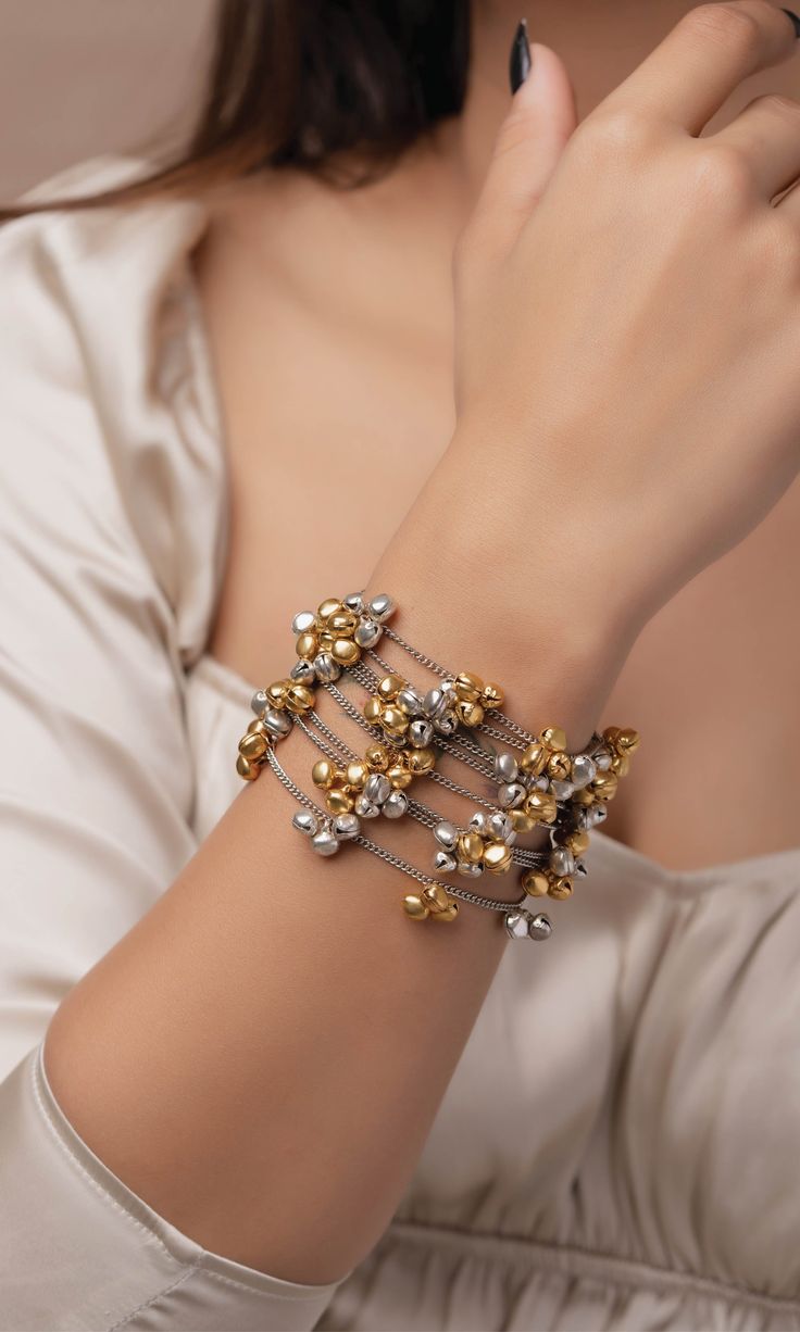 This collection is our best seller for a reason: it’s perfect amalgamation of traditional and modern designs. They are super versatile and light weight. This beautiful bracelet is handcrafted to perfection using fine quality brass, ghungroos with light silver and gold plating on it. Festive Fusion Metal Bracelets, Festive Silver Bracelet, Gold Dual-tone Bangle Jewelry, Festive Metal Bracelets With Latkans, Festive Metal Bracelet With Latkans, Silver Bracelets With Latkans As Gift, Metal Bracelets With Latkans As Gift, Dual-tone Gold Bracelets As Gift, Dual-tone Gold Bracelet As Gift