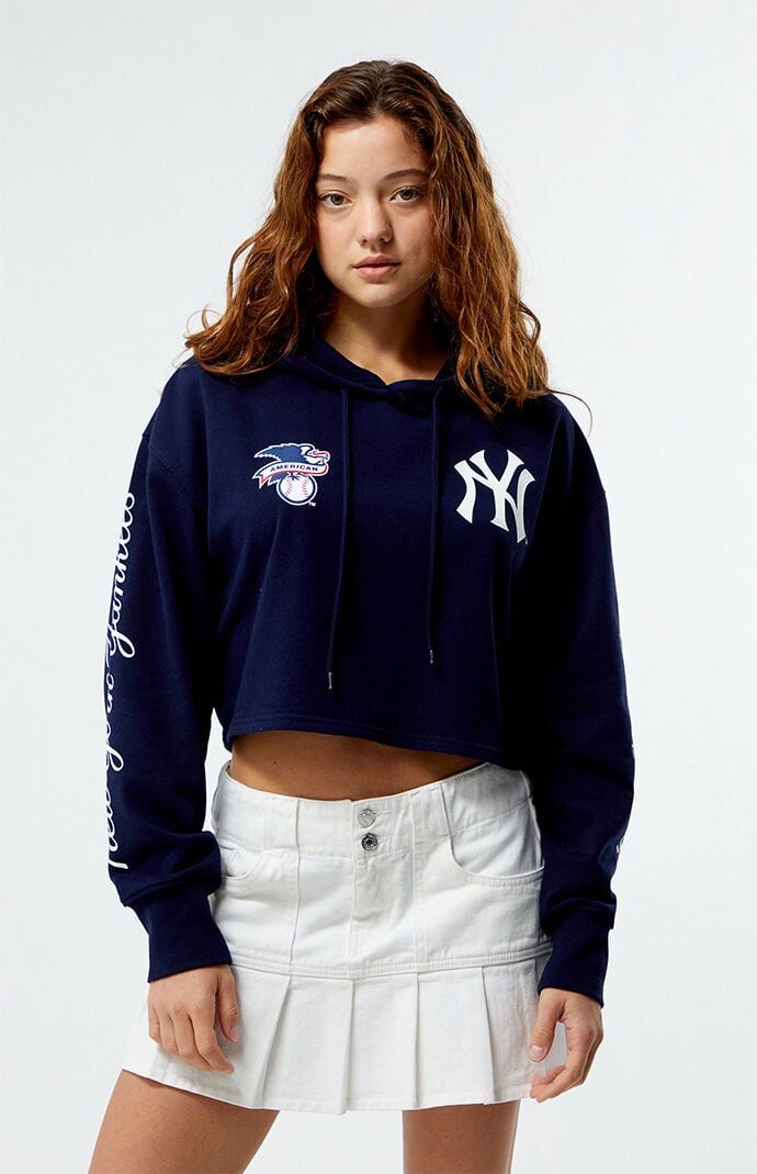 PacSun exclusive! Rock your team spirit with the MLB Wild Collective x PacSun Cropped Hoodie. This hoodie combines a relaxed fit and a drawstring hood for cozy coverage. Featuring baseball team graphics throughout, ribbed cuffs, and a cropped fit, it's perfect for showing off your style and support in a relaxed, sporty way.Solid color hoodieLong sleevesDrawstring hoodCustom graphicsCropped lengthRibbed cuffs80% cotton, 20% polyesterMachine washableModel is wearing a size smallModel measurements: 5’6.5” height, 32” bust, 23” waist, 35” hips Womens MLB Wild Collective x PacSun Cropped Hoodie - Blue size Large Sporty Sweatshirt With Drawstring Hood For Game Day, Casual Hooded Tops For Sports Events, Sports Event Hoodie With Drawstring Hood, Blue Hoodie Tops For Sports Events, Collegiate Hooded Tops For Sports Season, Collegiate Hooded Top For Sports Events, Casual Sports Hoodie With Drawstring, Casual Hoodie With Drawstring Hood For Sports Events, Team Spirit Tops With Drawstring Hood For Streetwear