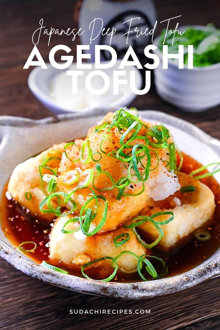 japanese deep fried tofu with vegetables and sauce in a bowl