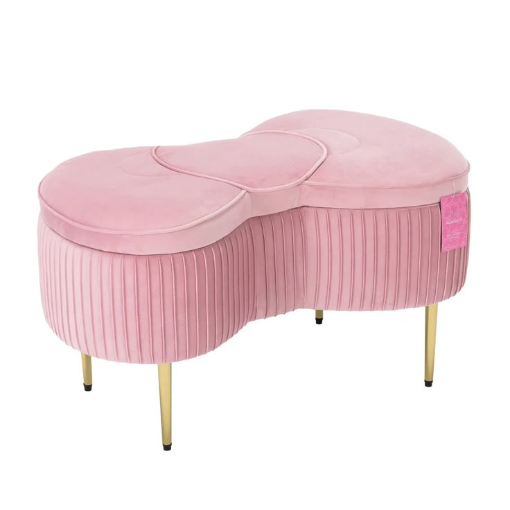 a pink bench with gold legs and a round shaped cushion on the top, sitting in front of a white background