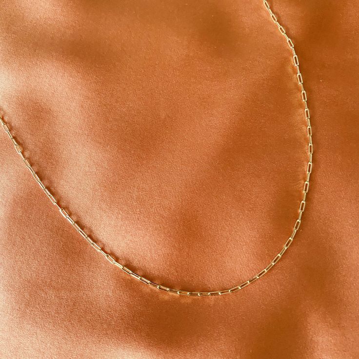 Want to add texture to your necklaces? This interlock chain is the perfect necklace to add to your collection 14k gold filled Chain length 16” Lobster clasp closure Chain does not rust or tarnish Please note that water and perfume can shorten the life span Clean your jewelry after each wear with a soft cloth **What is Gold Filled? Gold Filled jewelry undergoes a mechanical bonding process that melts a thicker layer of gold onto the base metal. It results in a more resilient exterior that’s not p Everyday 14k Gold Filled Paperclip Chain Necklace, Trendy Link Chain Necklace With Lobster Clasp, Gift Figaro Chain Necklace With Rectangular Links, Figaro Chain Necklace With Rectangular Links As Gift, Trendy Paperclip Necklace With Lobster Clasp, Trendy Paperclip Chain Necklace With Lobster Clasp, Everyday Charm Necklaces With Paperclip Chain In 14k Gold, Everyday Chain Link Charm Necklaces, Everyday Figaro Chain Jewelry In Paperclip Shape