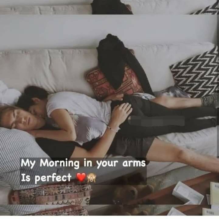 two people laying on a couch with the caption my morning in your arms is perfect