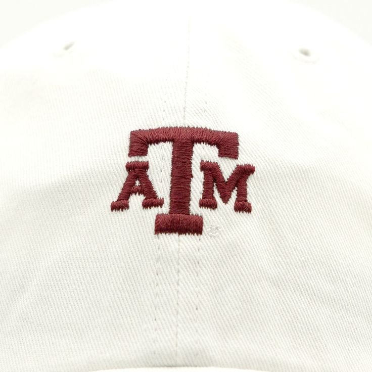 This is a super cute yet simple way to show off your A&M spirit. This is a white hat with a small logo of A&M in maroon on the front. It is perfect to keep you cooled off and goes with just about anything! White Snapback Hat For Game Day, White Cotton Trucker Hat With Embroidered Logo, White Curved Brim Trucker Hat For College, White Cotton Fitted Hat With Curved Bill, White Curved Bill Trucker Hat For Game Day, White Embroidered Logo Hat One Size, Casual White Dad Hat With Flat Bill, White Cotton Fitted Hat With Embroidered Logo, White Cotton Hat With Embroidered Logo