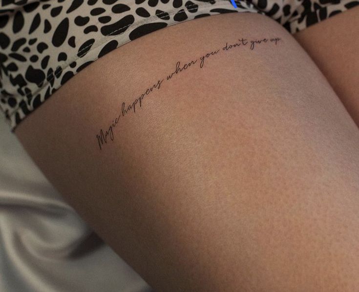 a woman with a tattoo on her thigh that says, may you always be loved by someone else