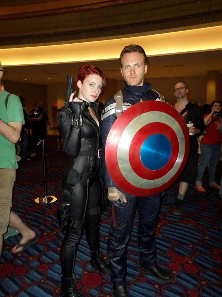 a man and woman dressed up as captain america