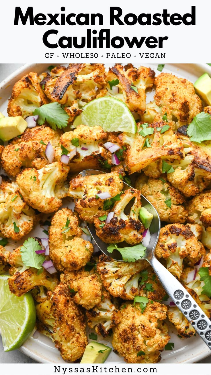 cauliflower with lime and cilantro on a white plate next to a spoon