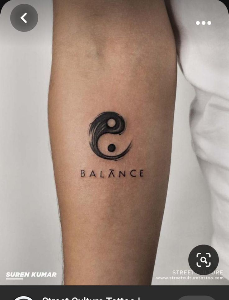 a tattoo with the word balance on it