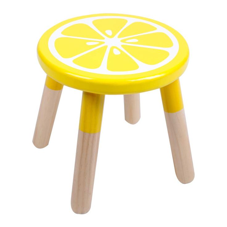 a yellow stool with wooden legs and a lemon slice on it