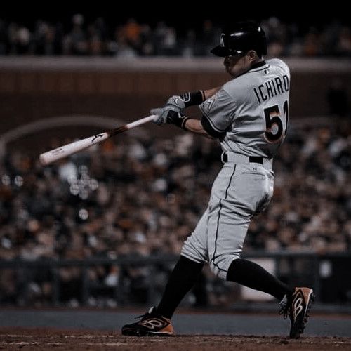 a baseball player is swinging his bat at the ball in front of an audience watching