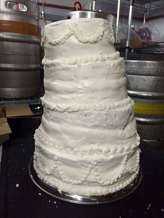 a large white cake sitting on top of a table