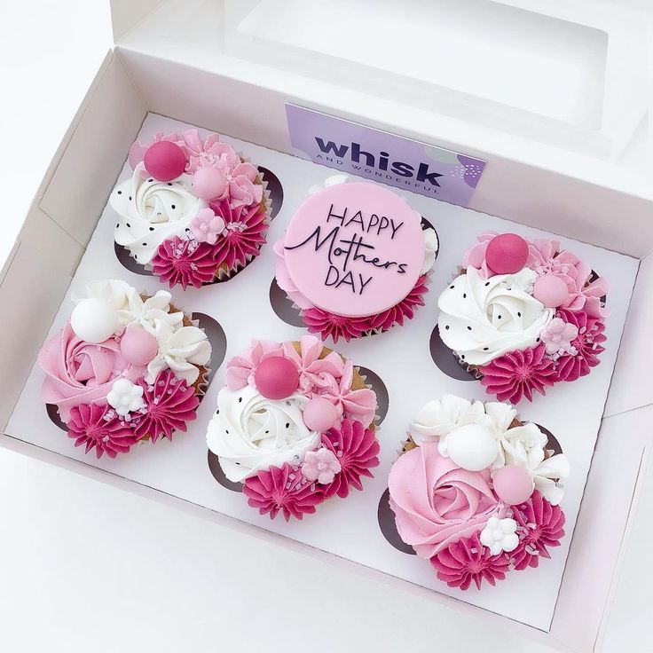 six cupcakes with pink and white frosting in a box that says happy mother's day