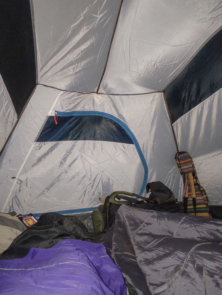 the inside of a tent that is covered with tarp