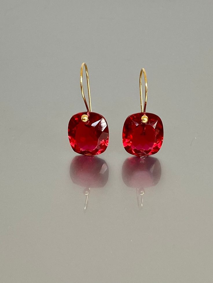 Beautiful red ruby earrings in Brilliant drops. The faceted rectangle drops have an amazing bright red color and are attached to 24K Gold Vermeil/ 14K SOLID GOD  ear wires.  The earrings are elegant, minimalist, and perfect to go with any outfit.   A truly gorgeous pair of earrings. When 14K SOLID GOLD ear wires are being used, the ear wire ends are hand stamped as proof of being 14K solid gold. In addition, extra work was done at the end of the ear wires to prevent any sort of pain or injury wh Red Faceted Jewelry For Formal Occasions, Formal Red Faceted Jewelry, Red Faceted Earrings For Anniversary, Red Square Cut Jewelry For Gift, Red Square Cut Jewelry Gift, Red Square Cut Jewelry For Formal Occasions, Rectangular Red Jewelry For Evening, Red Rectangular Jewelry For Evening, Formal Red Square Cut Jewelry