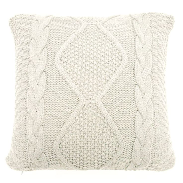 a white knitted pillow on a white background