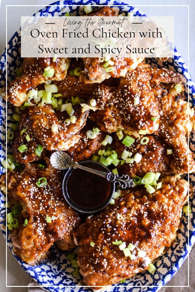 chicken wings with sweet and spicy sauce in a blue and white bowl on a table