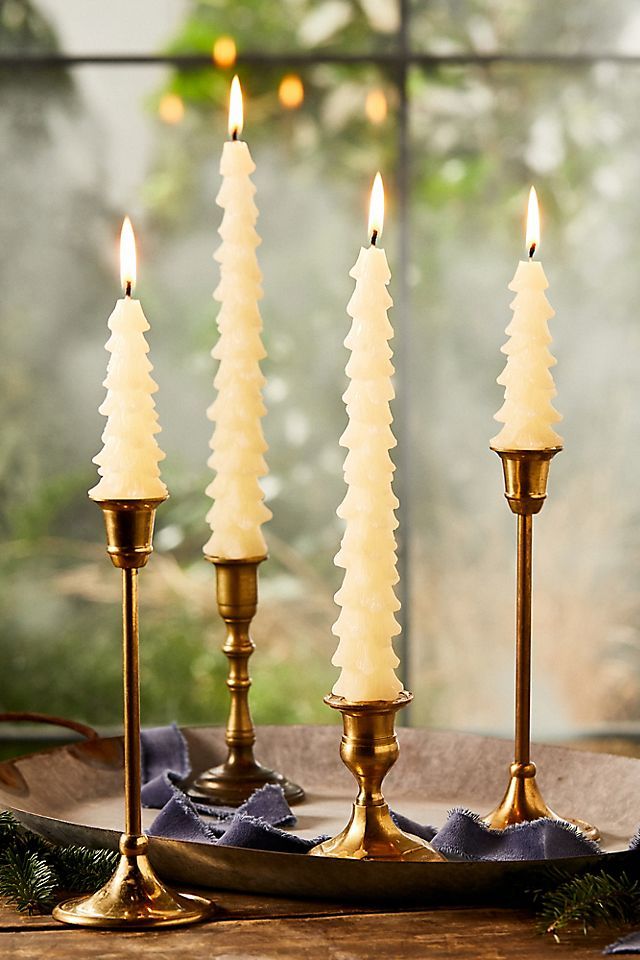 three candles are sitting on a table