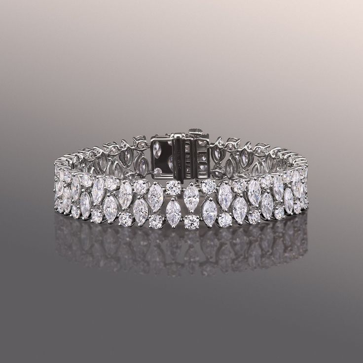 Indulge in the opulent brilliance of this diamond bracelet. By the bold patterned arrangement of round and marquise diamonds, the dazzling optical effect emphasizes each diamond's scintillation. The Dazzling, Infinity Pendant, Marquise Diamond, Fancy Color Diamonds, Gold Platinum, Three Stone, Lab Diamonds, Custom Rings, Diamond Rings