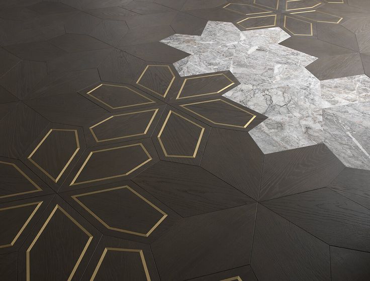 the floor is made out of marble and has gold lines on it, as well as an intricate design