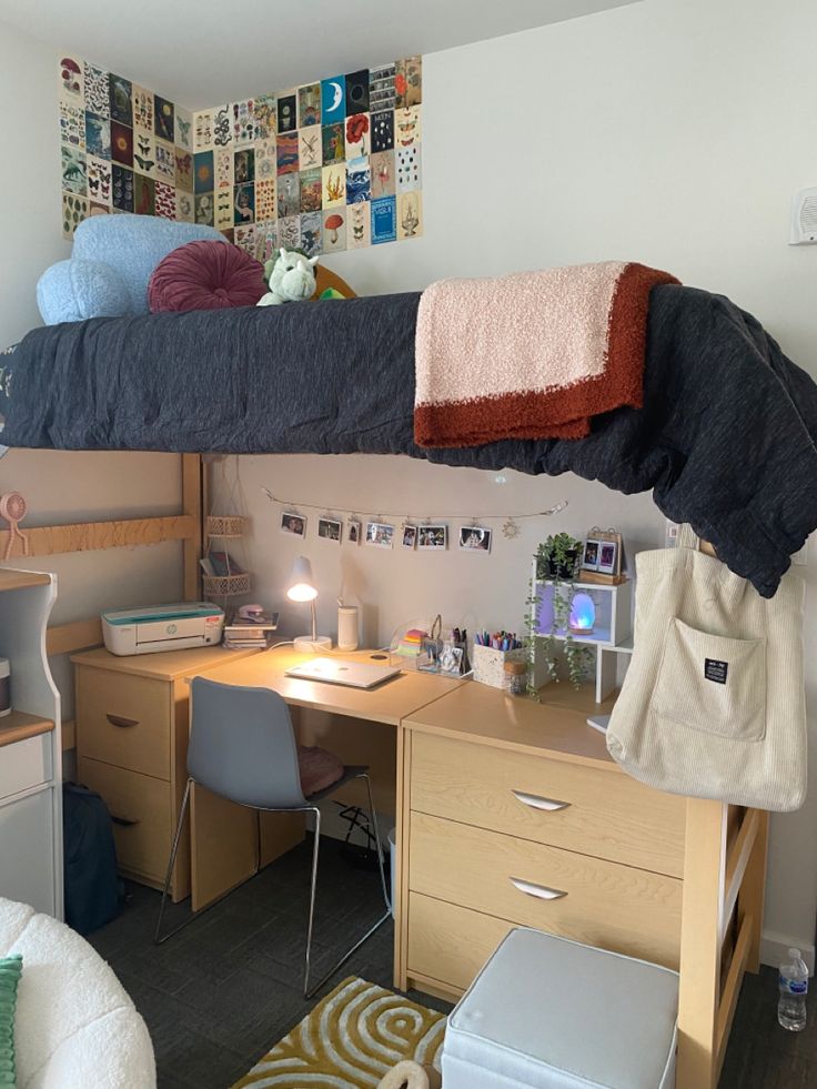 a bedroom with two bunk beds and a desk