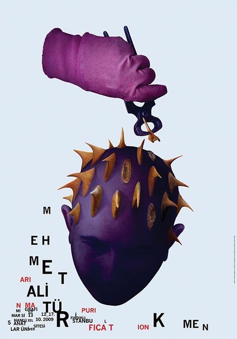 a purple poster with spikes on it's head is being held by a hand