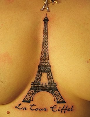 a woman's breast with the eiffel tower tattoo on it, and words written in french