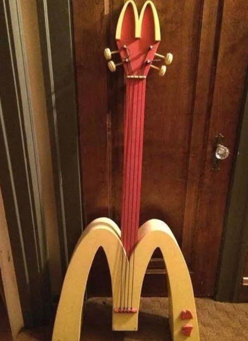 a guitar shaped like a mcdonald's sign