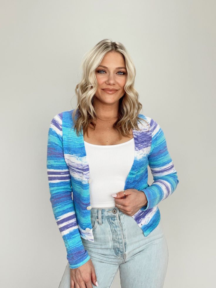 Show off your unique style with this Blue Swirl Retro Cardigan! Featuring an ultra soft and stretchy knit, this colorful swirl pattern is sure to make a vibrant statement. Feel free to add a pop of color to your wardrobe with this elevated and truly unique piece––perfectly suitable for spring and summer. With button closures and a cropped fit with a v-neckline, you'll surely be having loads of fun! (Wear it with a smile!) 100% Nylon Hand wash cold Retro Cardigan, Retro Cardigans, Blue Swirl, Kimono Cardigan, Swirl Pattern, Dresses Xs, Unique Pieces, Swirl, Royal Blue