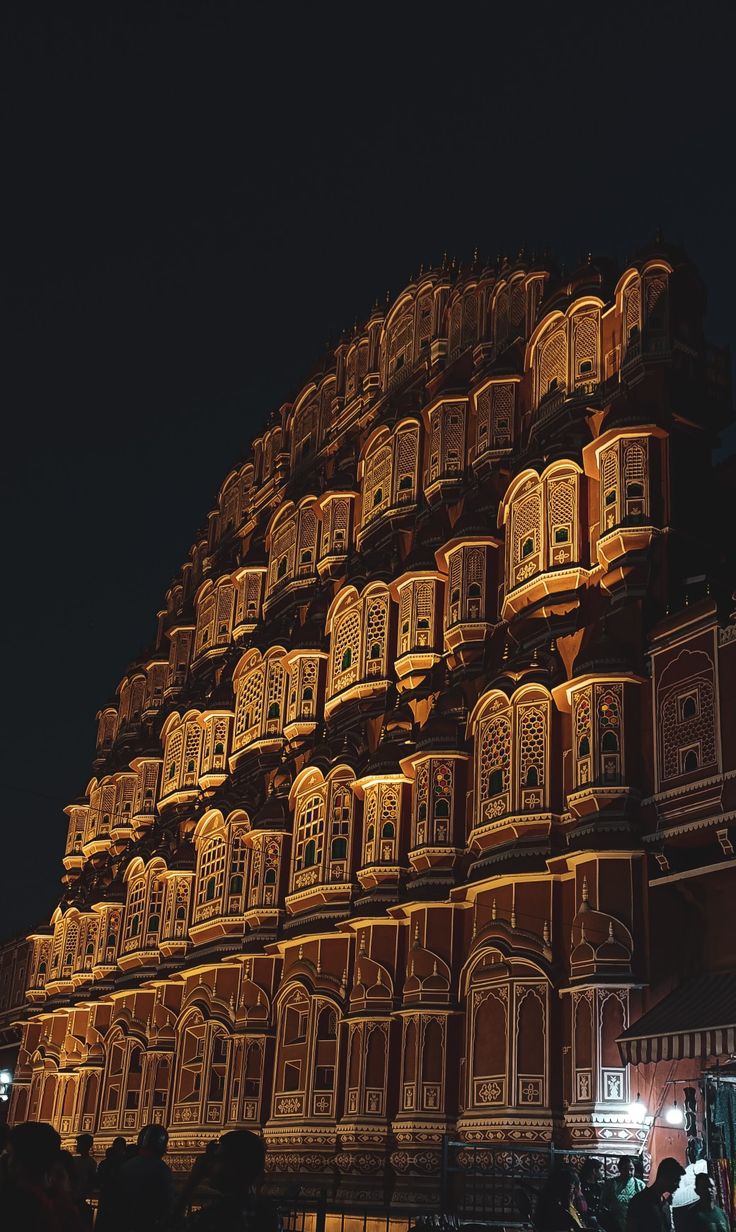 an ornate building lit up at night