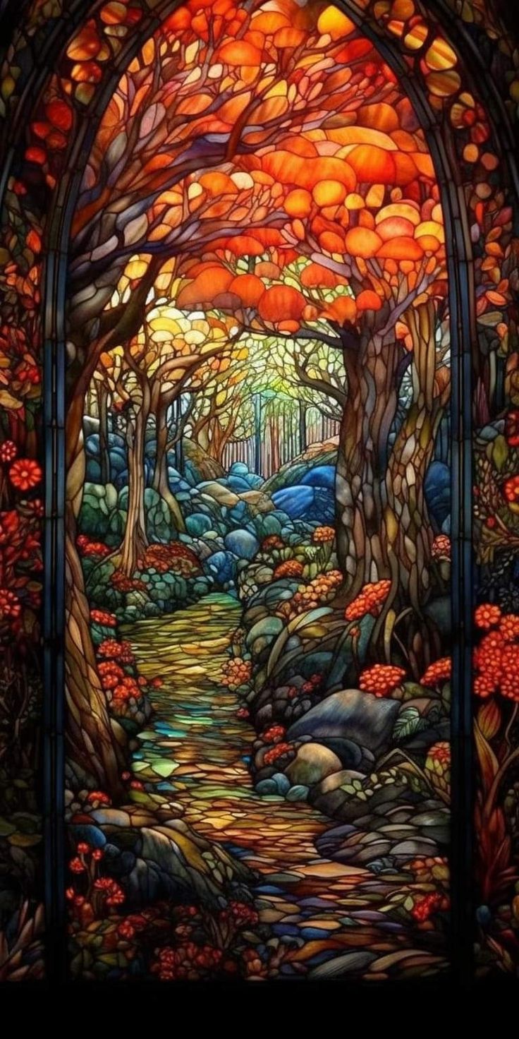 a stained glass window with trees and rocks