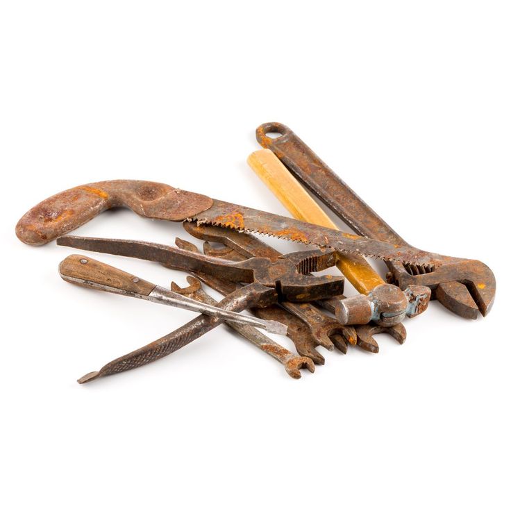 old rusty wrenches and pliers on white background