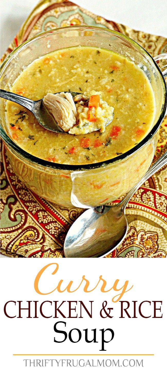 a bowl of chicken and rice soup with a spoon in it on top of a table