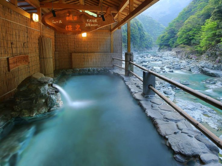 an indoor hot tub in the middle of a river