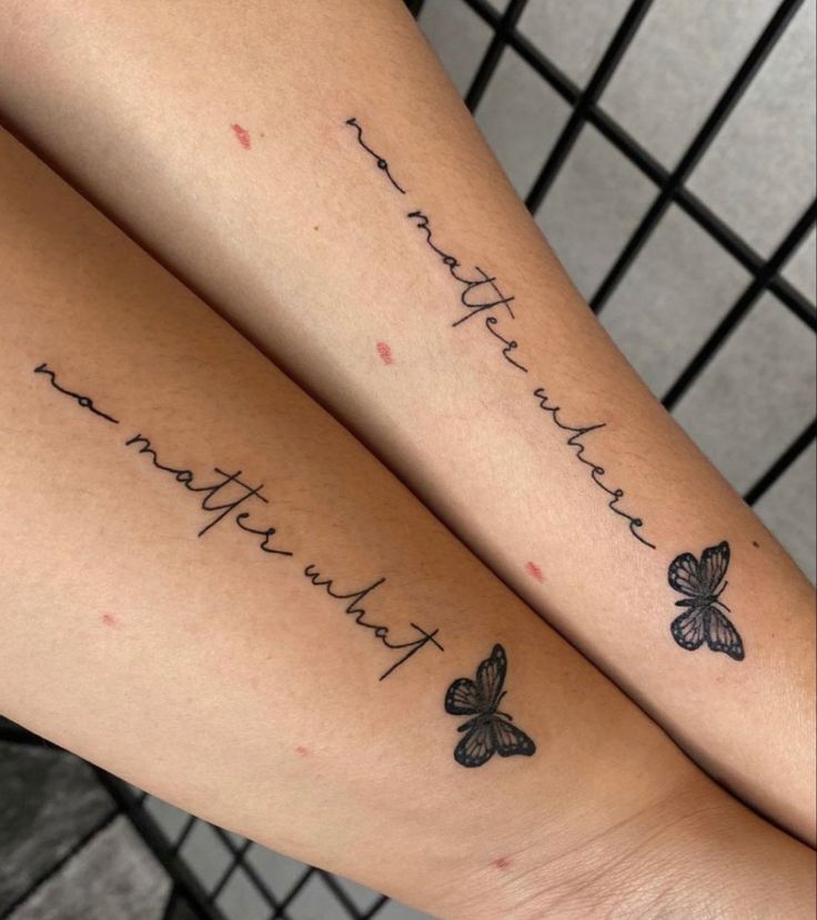 two girls with matching tattoos on their arms