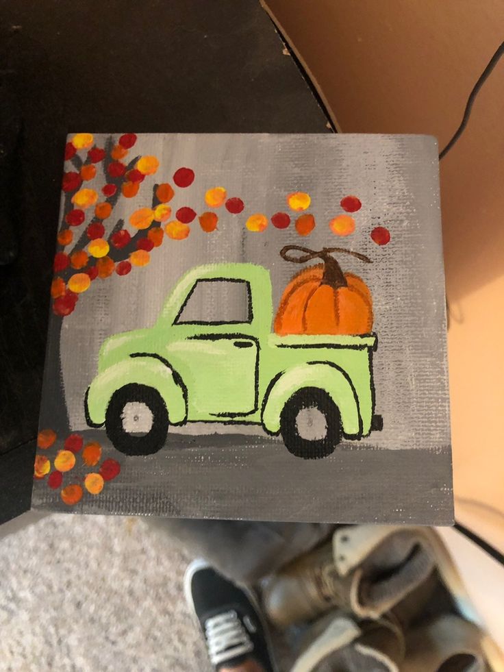 a painting of a green truck with pumpkins on it