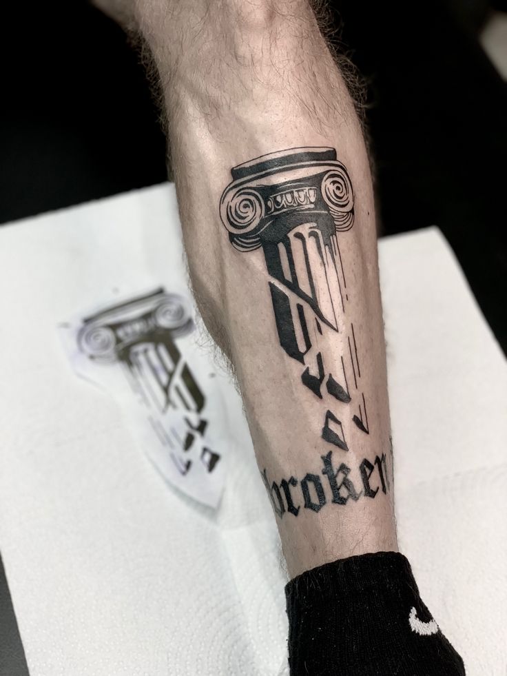 a man's arm with a tattoo on it and the words brooklyn written in cursive font