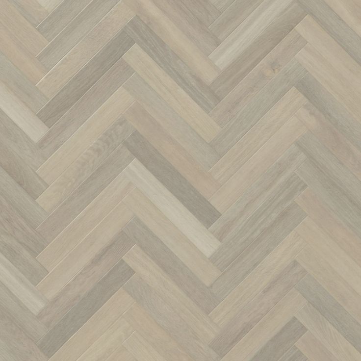 an image of wood flooring that looks like chevron herringbones in grey and white